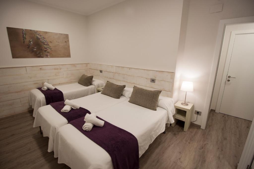 Cama o camas de una habitación en Pensión San Martin