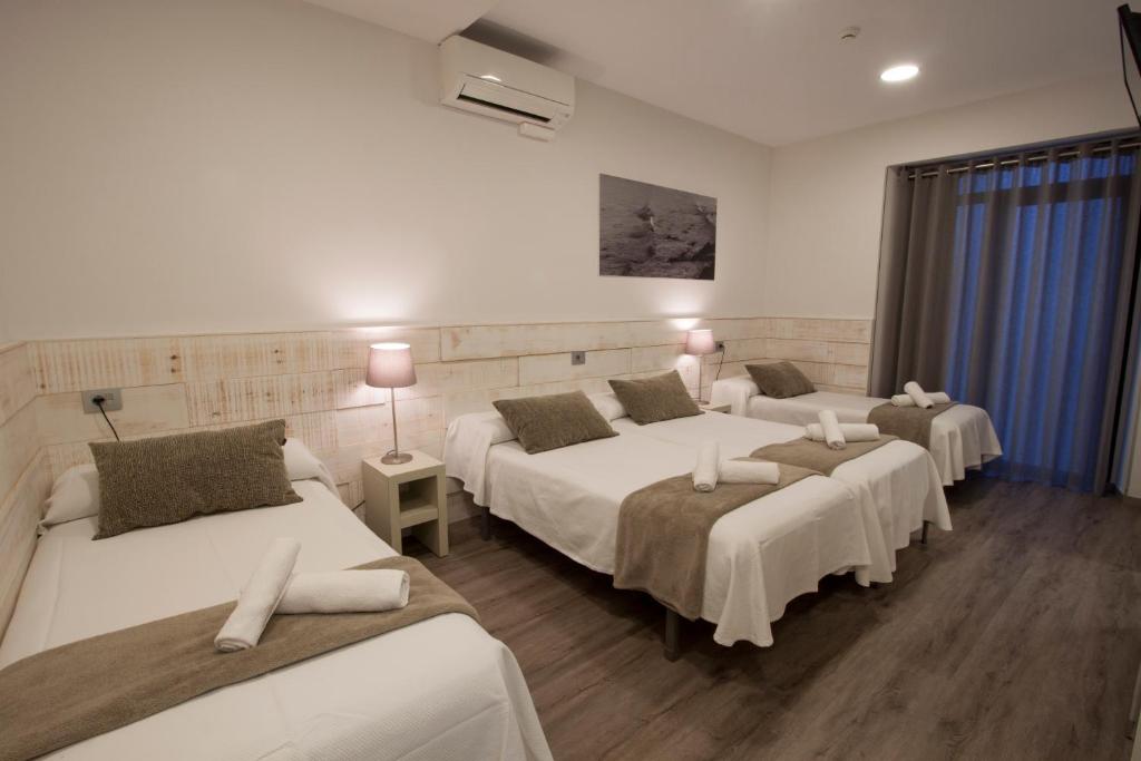 Cama o camas de una habitación en Pensión San Martin