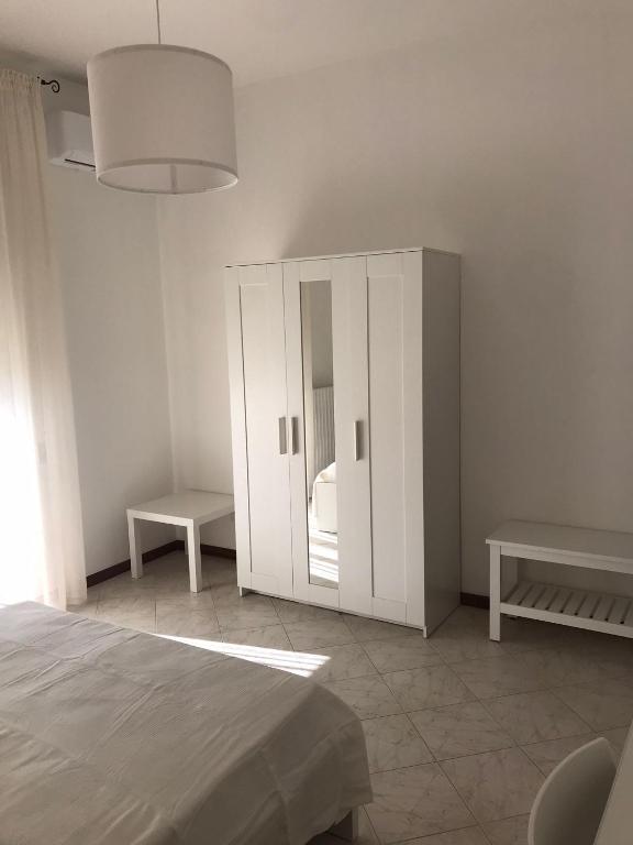 Łóżko lub łóżka w pokoju w obiekcie Cà del Mar