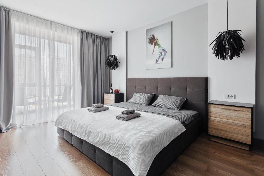 Кровать или кровати в номере Grey Apartment