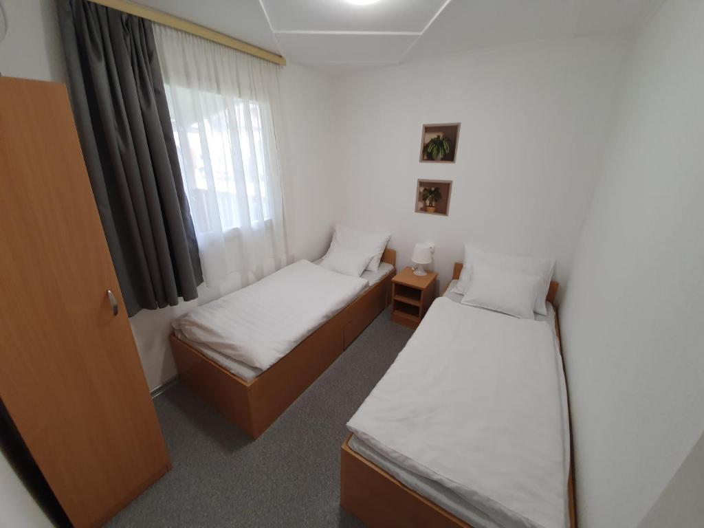 Postel nebo postele na pokoji v ubytování Harmónia faházak