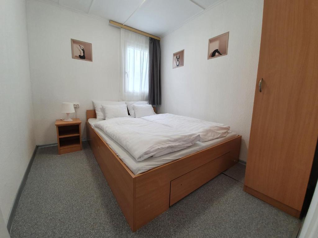 Postel nebo postele na pokoji v ubytování Harmónia faházak