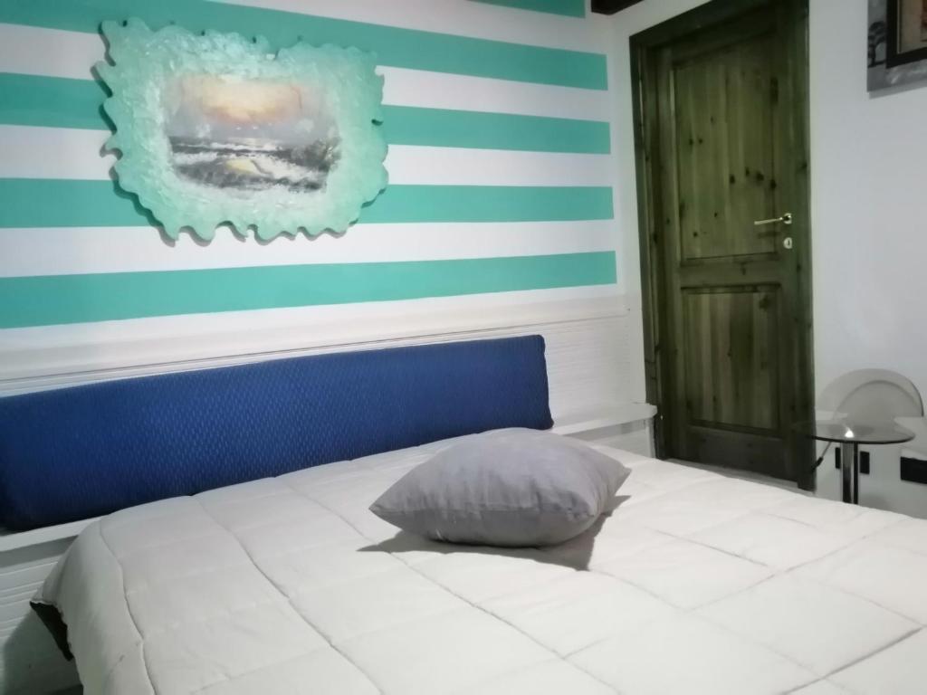 Posteľ alebo postele v izbe v ubytovaní Appartamento Picasso