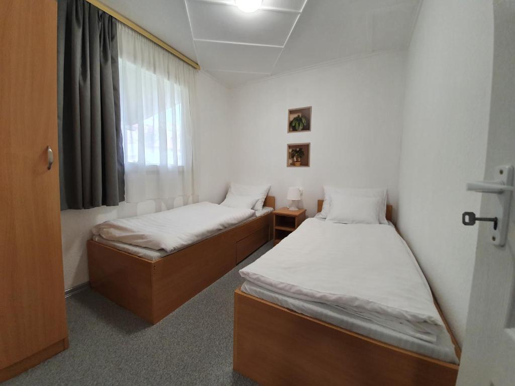 Postel nebo postele na pokoji v ubytování Harmónia faházak