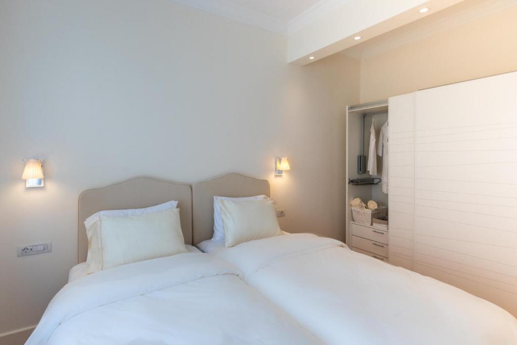 Posteľ alebo postele v izbe v ubytovaní Etoile Luxury Suites