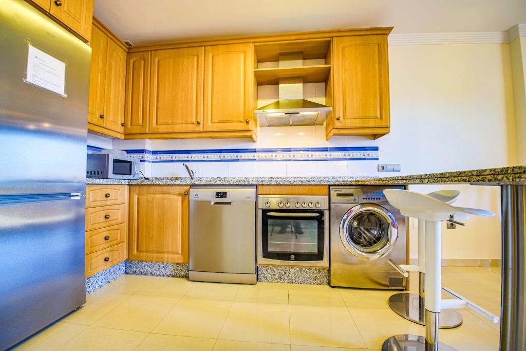 Kuchyňa alebo kuchynka v ubytovaní Bonito apartamento al lado de la playa con vistas al mar