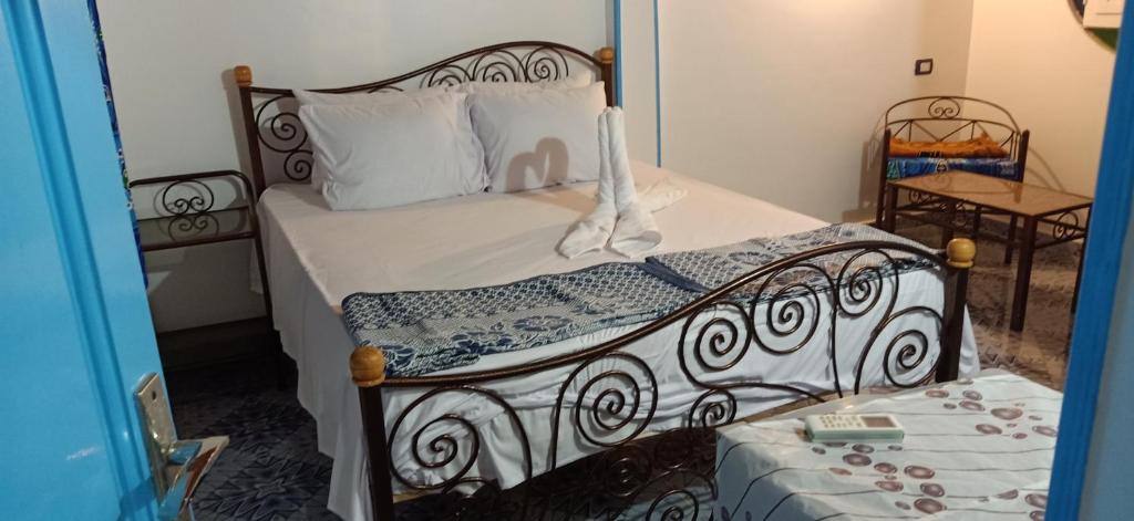 Postel nebo postele na pokoji v ubytování Nuba Tod Abouda Guest House