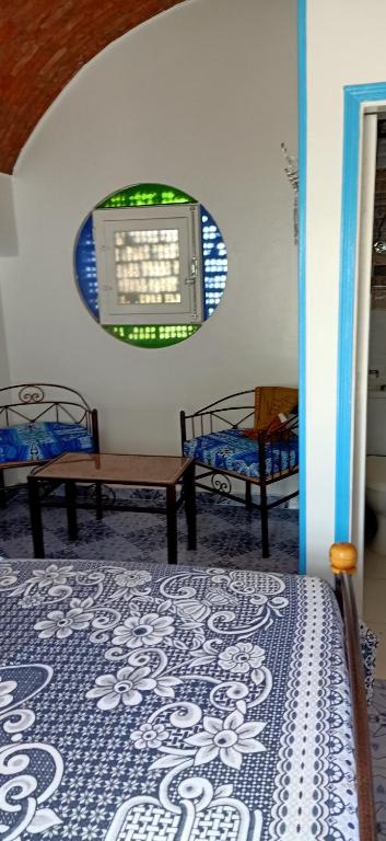 Postel nebo postele na pokoji v ubytování Nuba Tod Abouda Guest House