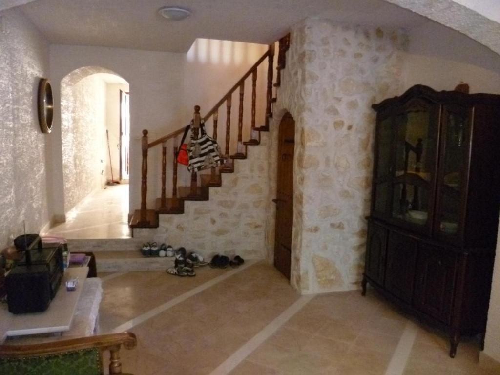 a hallway with a staircase in a house at Apartment in Zlarin with balcony, W-LAN, washing machine (3813-2) in Zlarin