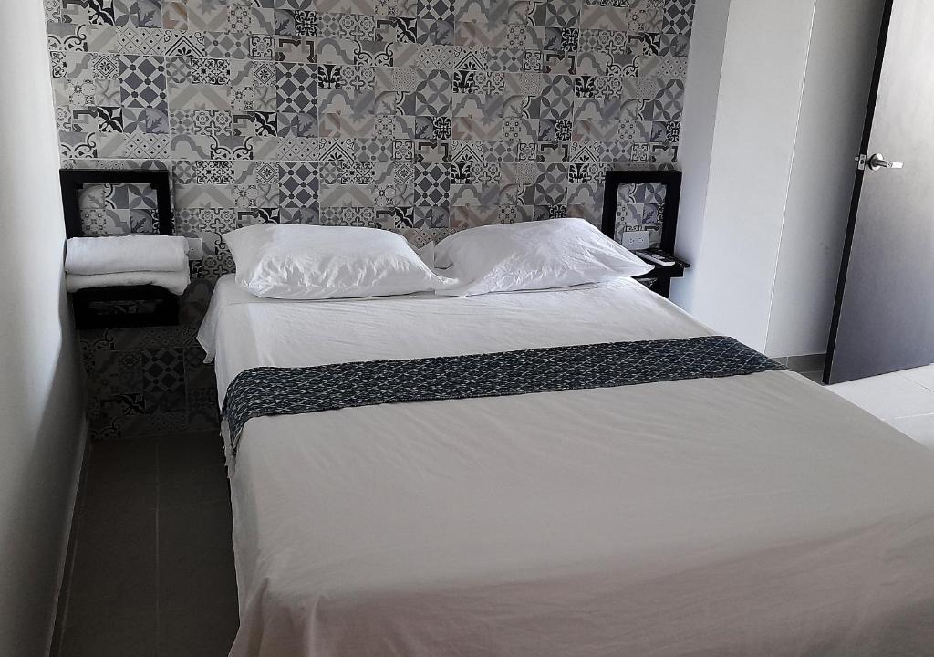 Postel nebo postele na pokoji v ubytování Apartamentos Las Piloneras
