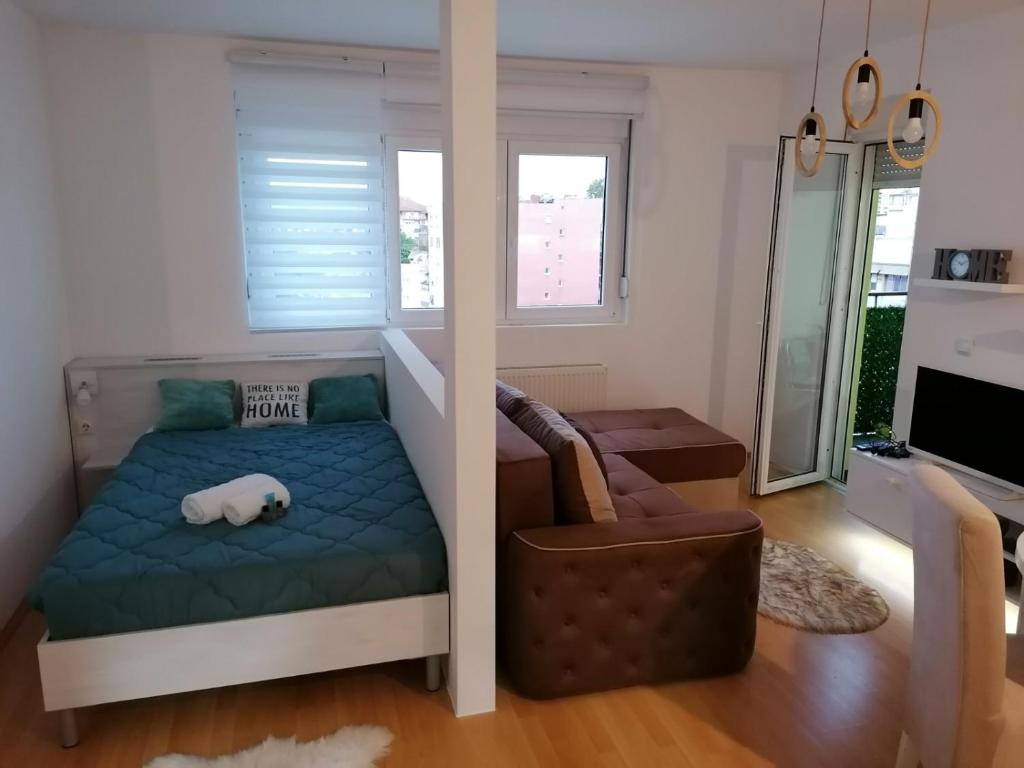 Postel nebo postele na pokoji v ubytování Emili Apartman