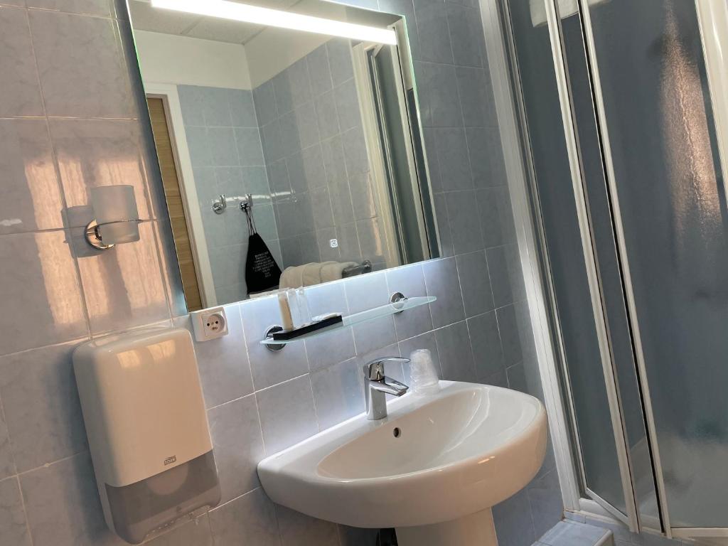 Koupelna v ubytování Hôtel Neptune