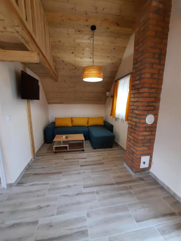 a living room with a couch and a table at Villa M in Vinci