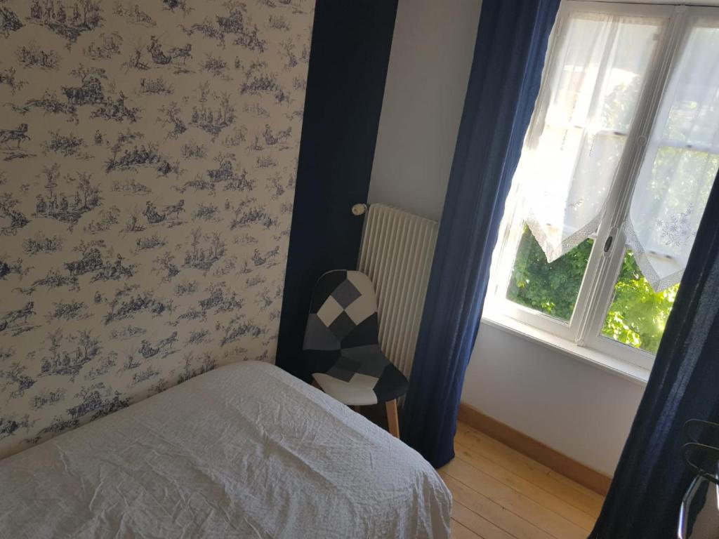 Postel nebo postele na pokoji v ubytování LE RELAIS VAUBAN