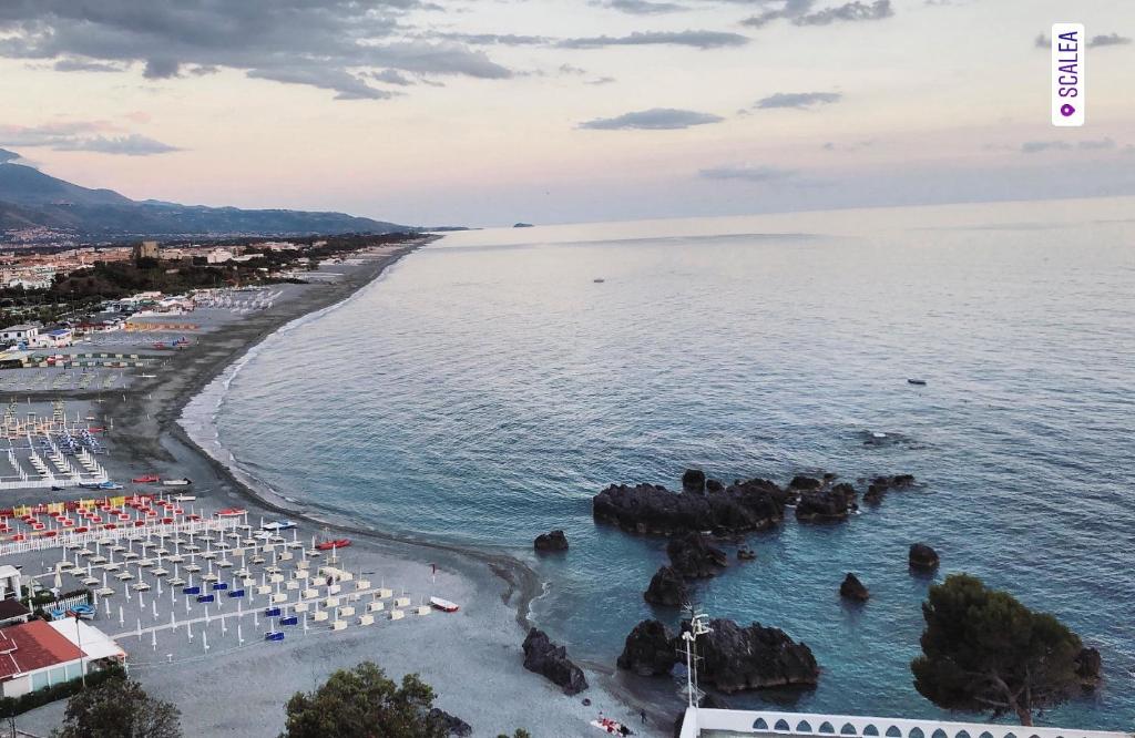 an aerial view of a beach and the ocean at La Pedrosa 83 in Scalea