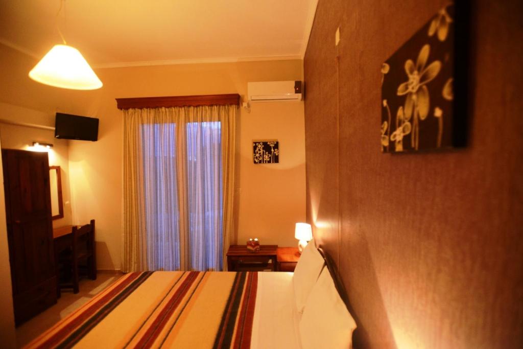Postel nebo postele na pokoji v ubytování Argo Hotel