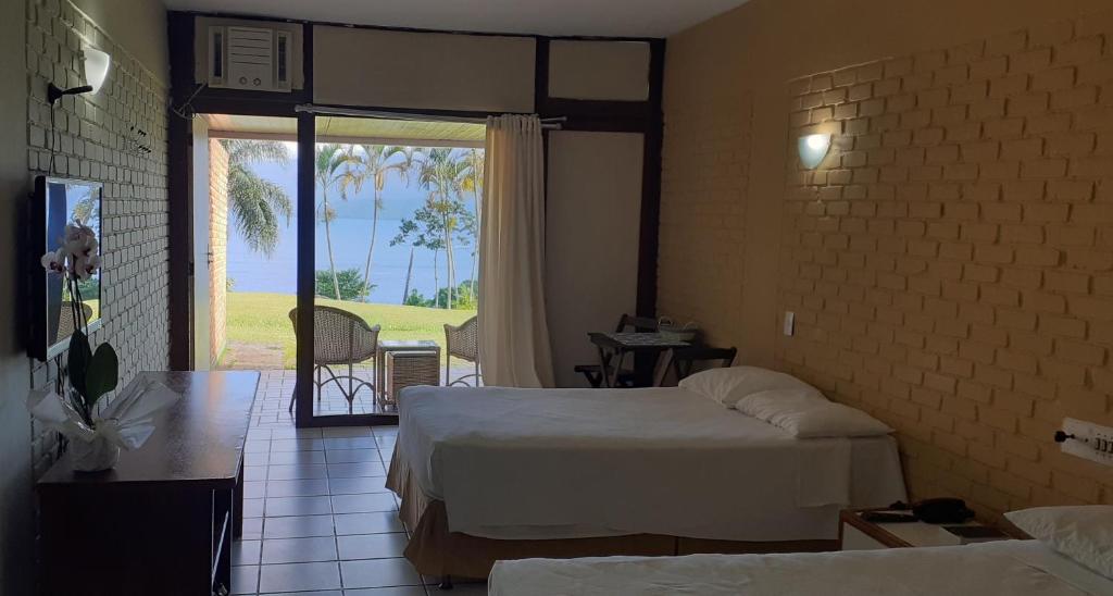 Postel nebo postele na pokoji v ubytování Angra dos Reis Flat Suíte no Portogalo