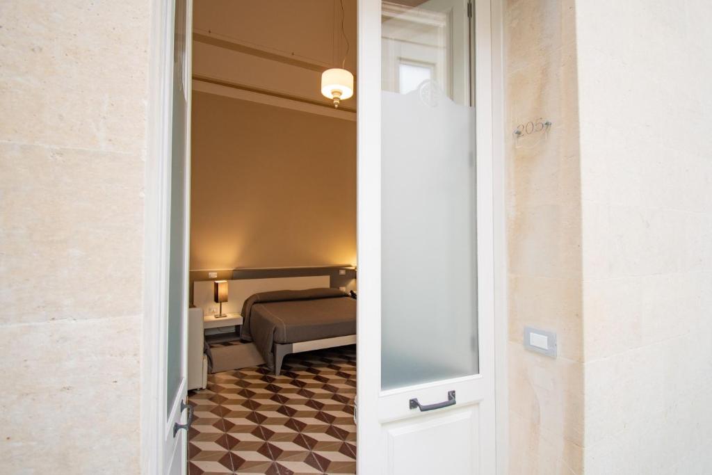 Postel nebo postele na pokoji v ubytování Hotel Belami