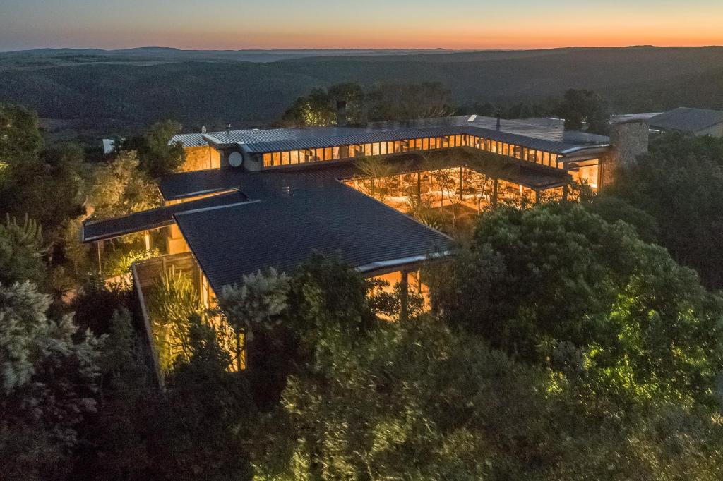 an aerial view of a house in the woods at Kariega Game Reserve Ukhozi Lodge in Kenton on Sea