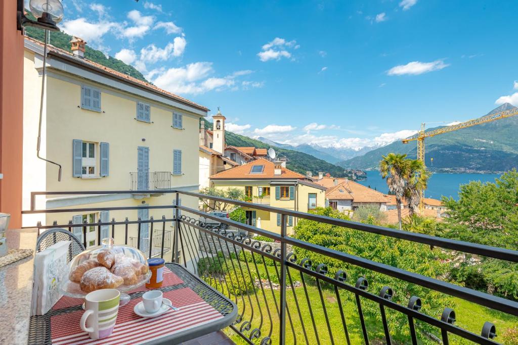 a balcony with a table with donuts on it at Casa Bellavista Wi-Fi Parking Free in San Siro