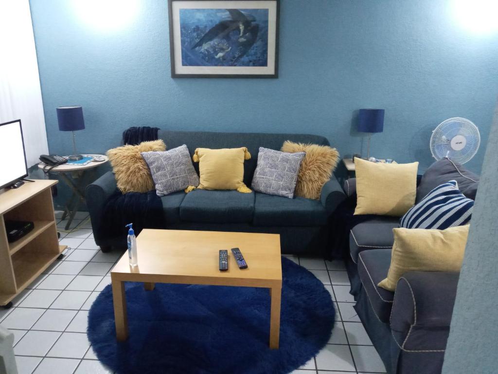 a living room with a couch and a coffee table at Blue House in Ensenada