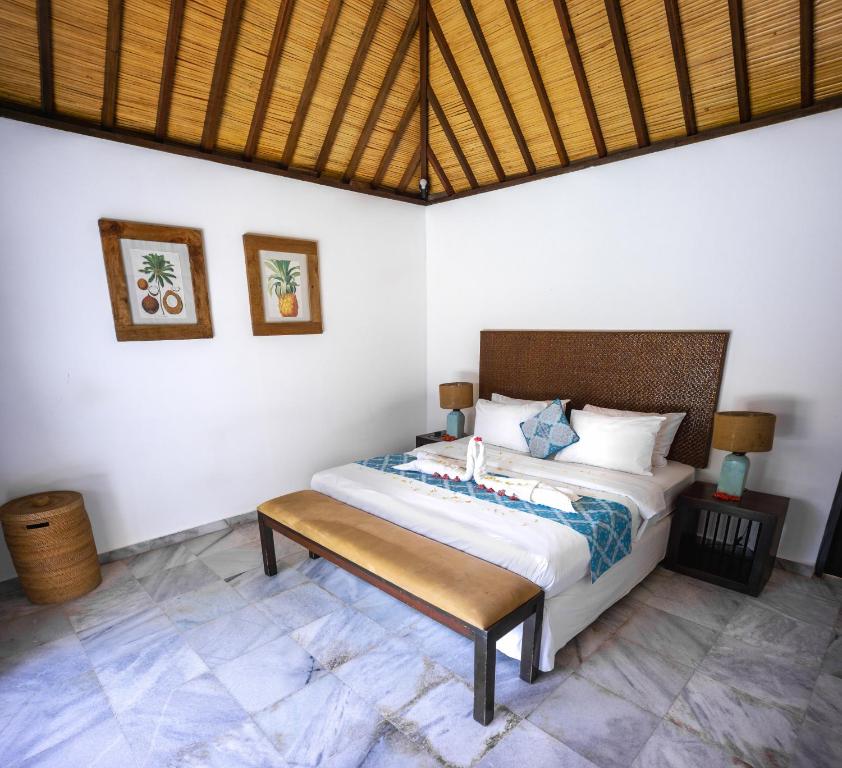 Postel nebo postele na pokoji v ubytování Gili Villas