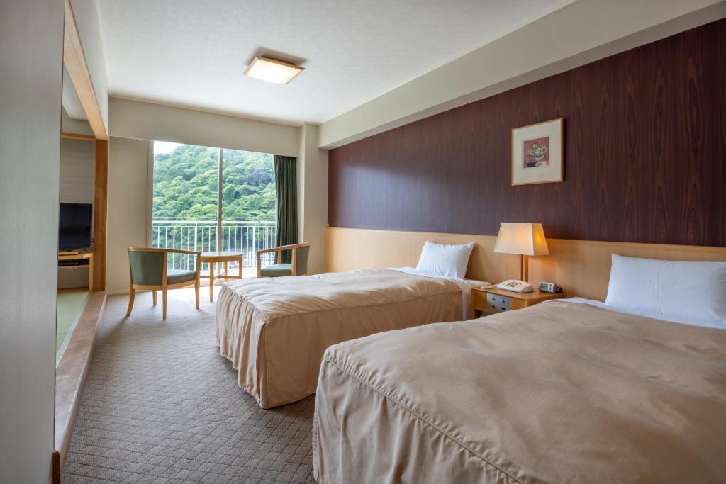 Postel nebo postele na pokoji v ubytování Yumoto Fujiya Hotel
