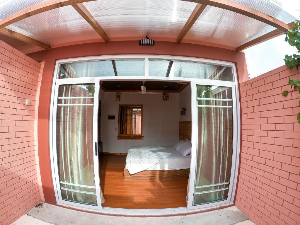 Postel nebo postele na pokoji v ubytování New Breeze Thoddoo Inn