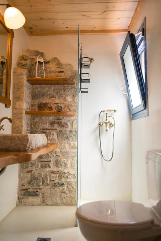 A bathroom at Chaihoutes stone villa into Olive farm in Zia