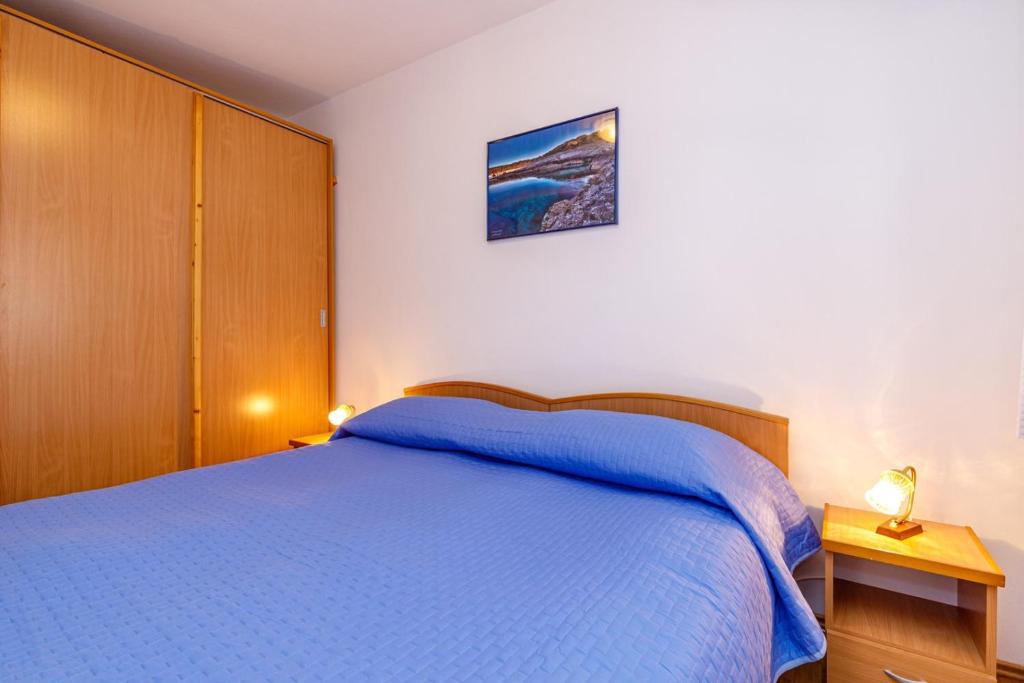 Postel nebo postele na pokoji v ubytování Holiday House Emma