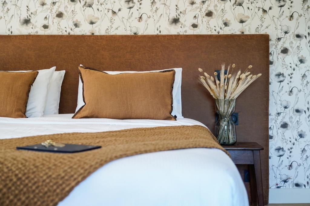 Postel nebo postele na pokoji v ubytování Hôtel Le Mouton Bleu