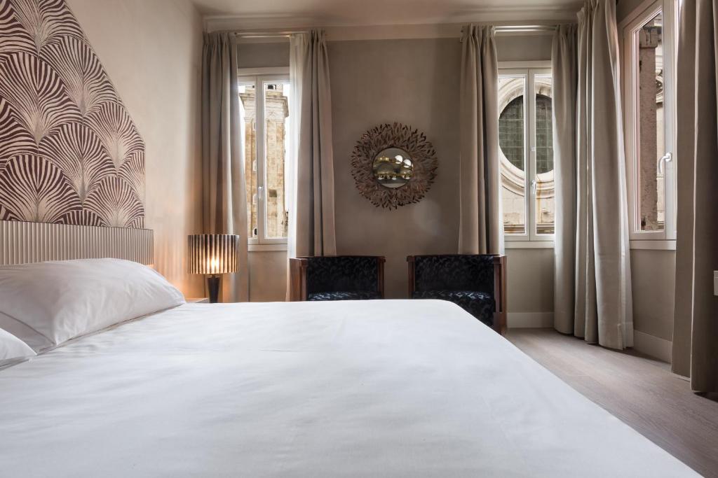 Postel nebo postele na pokoji v ubytování Liassidi Wellness Suites