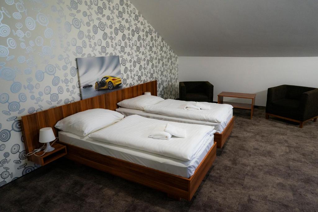 Posteľ alebo postele v izbe v ubytovaní Hotel Ring