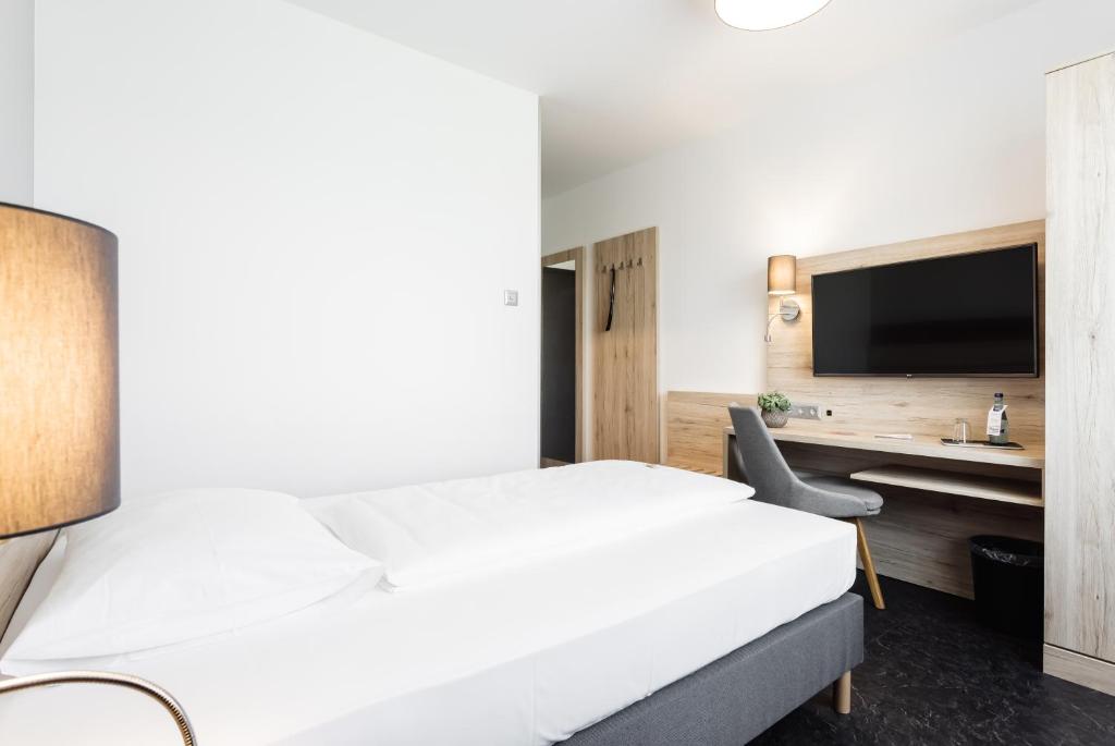 Posteľ alebo postele v izbe v ubytovaní Hotel Smart Liv'in