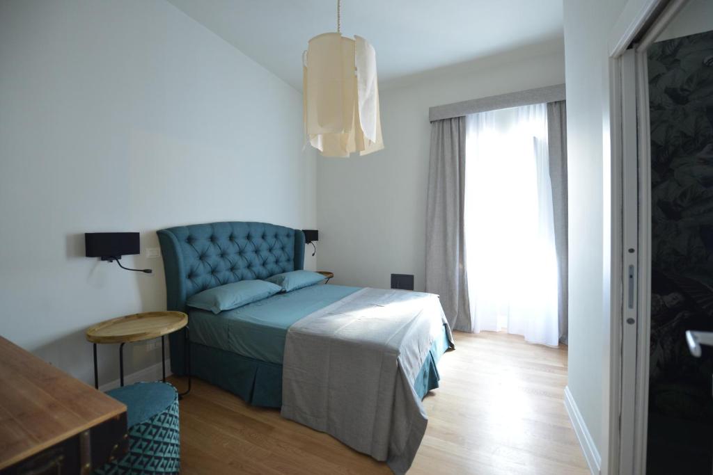 Postel nebo postele na pokoji v ubytování Domus D'Angelo B&B