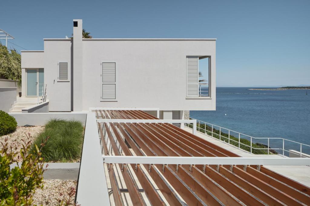 a house with a view of the ocean at Villa Roca in Vis