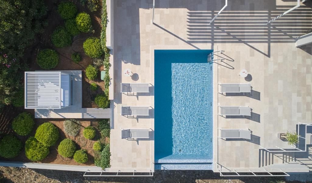 an overhead view of a swimming pool in a building at Villa Roca in Vis