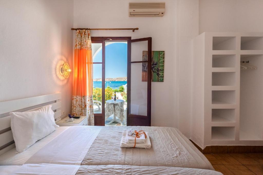 Postel nebo postele na pokoji v ubytování Stella Hotel