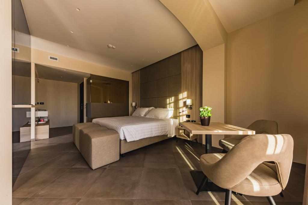 Postel nebo postele na pokoji v ubytování Salina Hotel