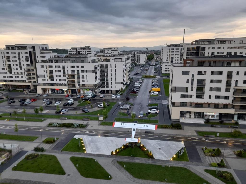 an aerial view of a city with white buildings at Luxury panorama apartament,Coresi in Braşov