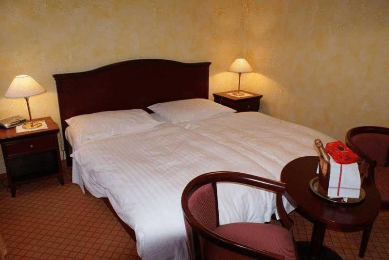 Postel nebo postele na pokoji v ubytování Hotel de Bahyse