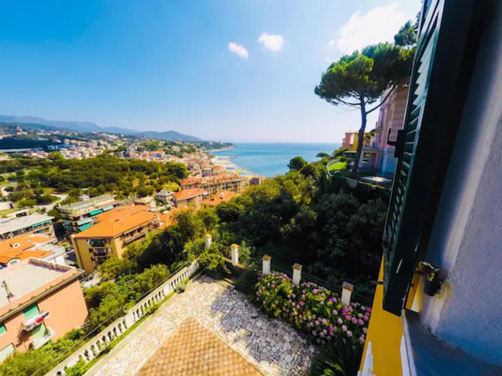 a view of a city and the ocean from a building at Splendido Appartamento Vista Mare in Celle Ligure
