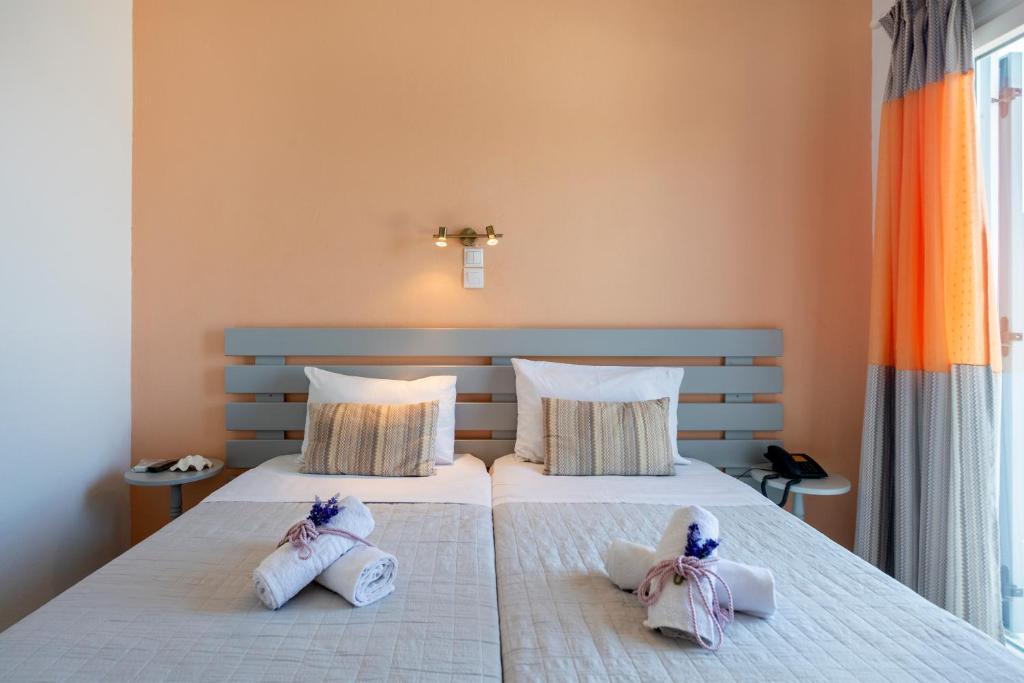 Postel nebo postele na pokoji v ubytování Stella Hotel