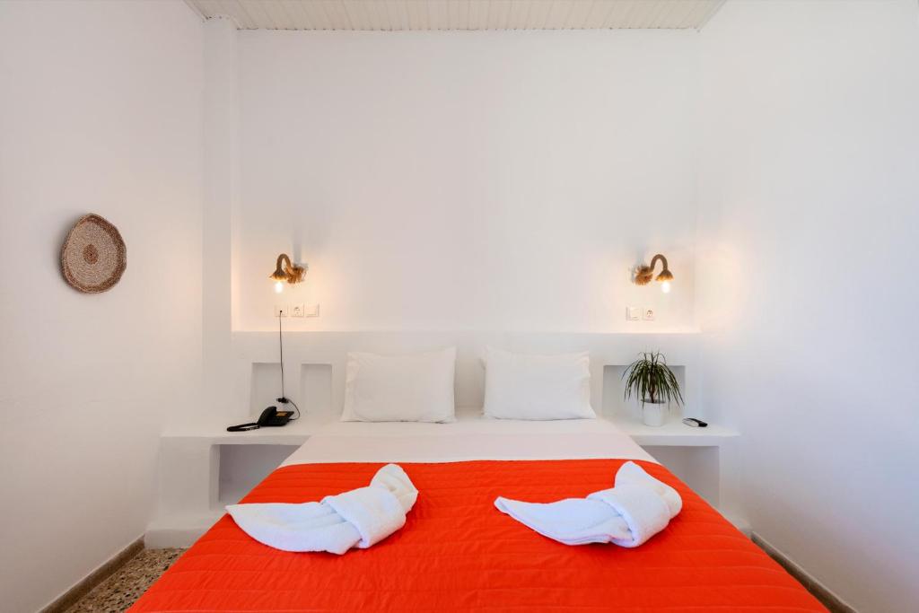 Postel nebo postele na pokoji v ubytování Stella Hotel