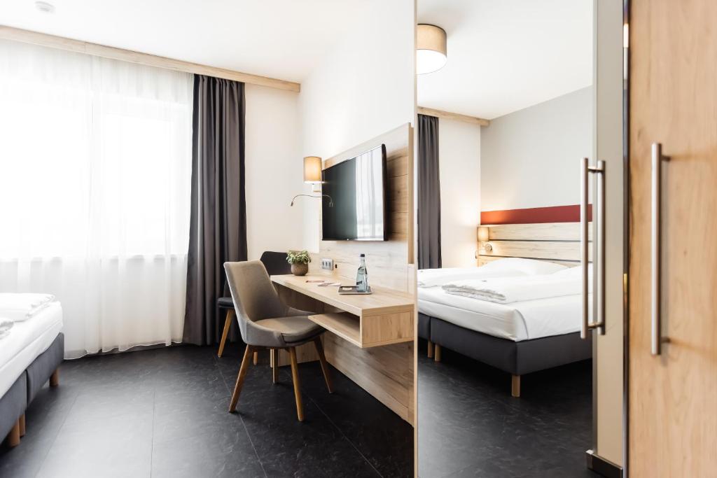 Posteľ alebo postele v izbe v ubytovaní Hotel Smart Liv'in