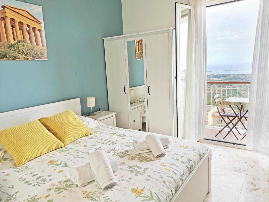 Postel nebo postele na pokoji v ubytování B&B MiraValle Agrigento