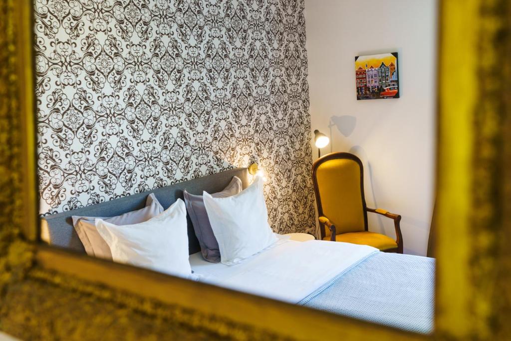 Postel nebo postele na pokoji v ubytování Logement Onze Chambres & Gîtes