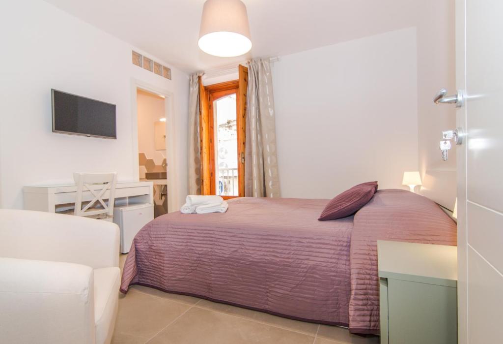 Postel nebo postele na pokoji v ubytování Casa Di Hilde