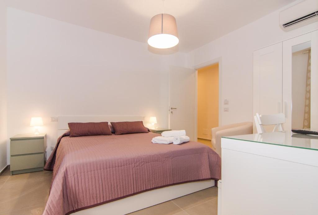 Postel nebo postele na pokoji v ubytování Casa Di Hilde