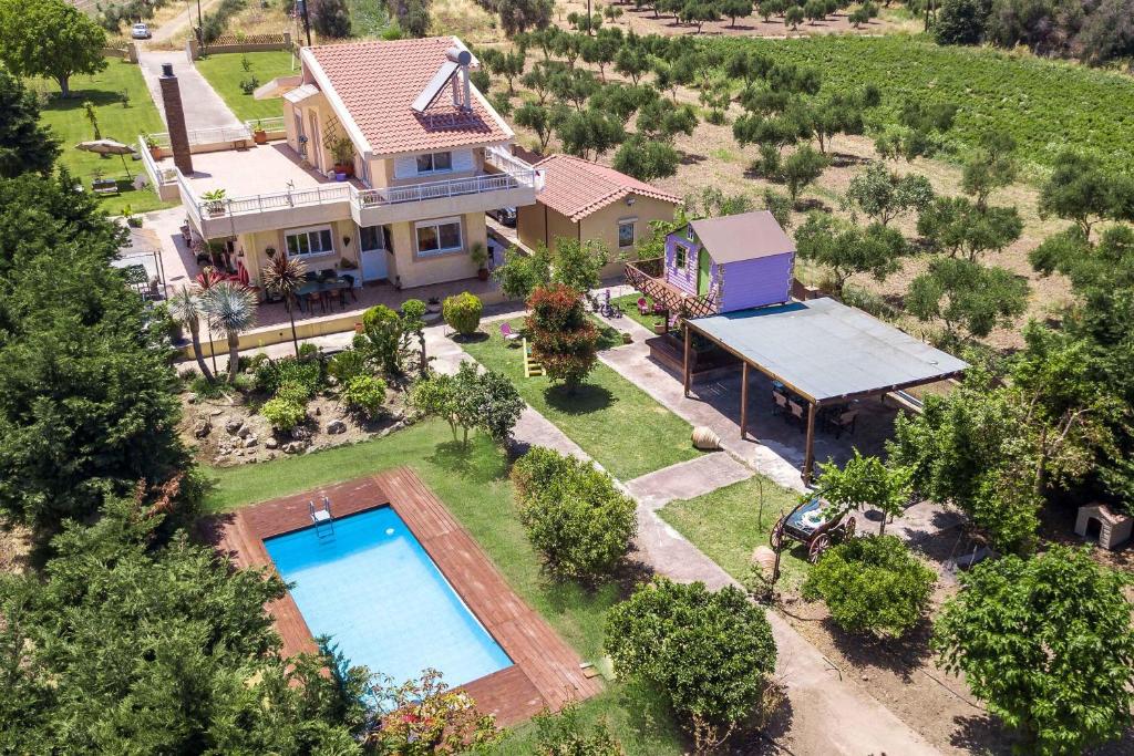 an aerial view of a house with a swimming pool at Laylande House in Theologos